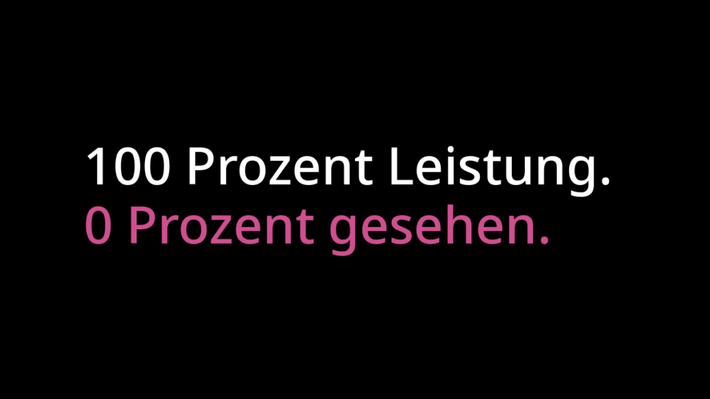 "100 Prozent Leistung" in weißer Schrift. Darunter "0 Prozent gesehen" in pinker Schrift. Beides auf schwarzem Hintergrund.